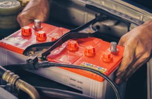 A car mechanic replaces a battery | Vancouver, WA