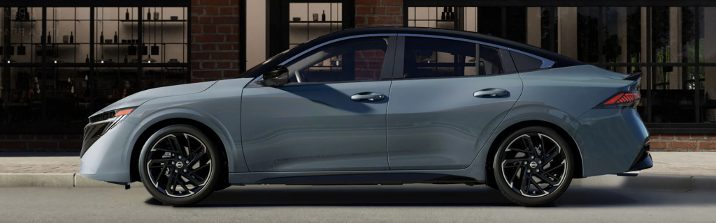 Side profile of a grey sedan parked on a city street