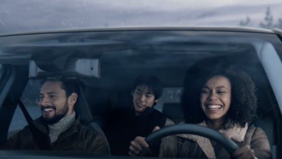 Three passengers riding in a vehicle and smiling | Alan Webb Nissan in Vancouver WA