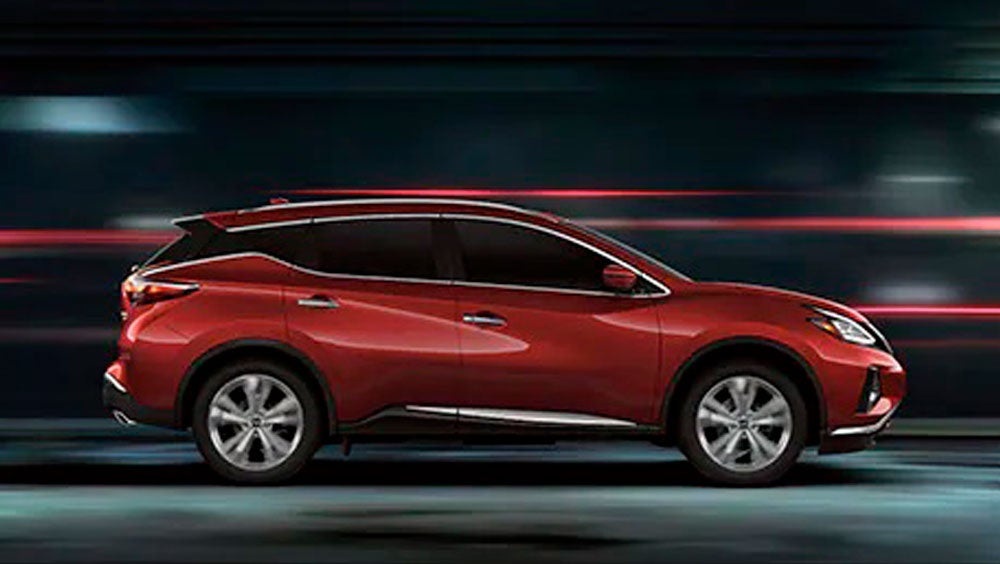 2023 Nissan Murano shown in profile driving down a street at night illustrating performance. | Alan Webb Nissan in Vancouver WA