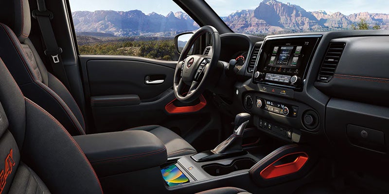 interior view from the passengers seat of dashboard and steering wheel of the 2024 nissan frontier