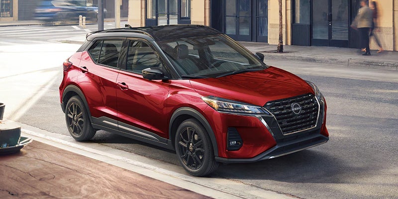 right profile of a red 2024 nissan kicks