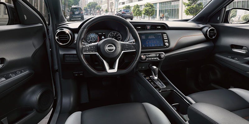 2024 nissan kicks interior view of front seats and steering wheel
