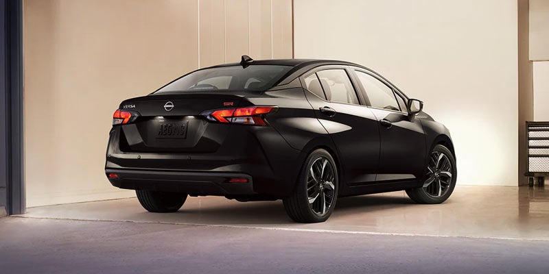 rear view of a black 2024 nissan versa